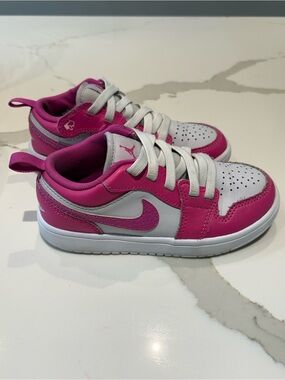 Nike Jordan 1 Low Alt sneakers Fire Pink and White colorway Velcro Closure